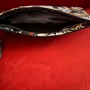 Clutch with wrist strap